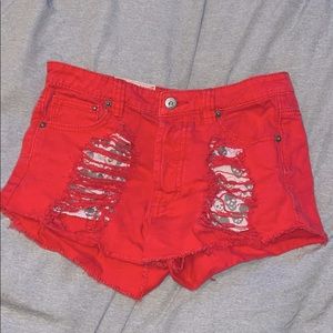 red distressed shorts